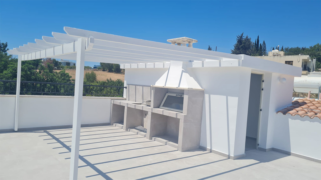 Terrace with Outdoor Rotisserie at CBA Valley Apartments in Mesa Chorio, Cyprus